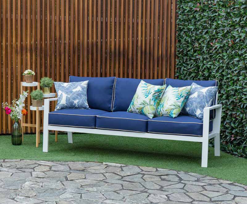 McClellan Outdoor Patio Sofa with Cushions in a backyard setting.