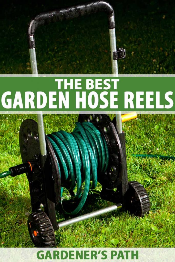 A wheeled garden hose reel on a green lawn at night.