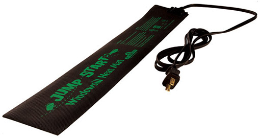 A close up of a Jump Start heat mat with green text and a power cord, on a white background.