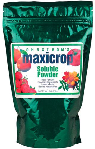 A close up of the packaging for Maxicrop powdered fertilizer.