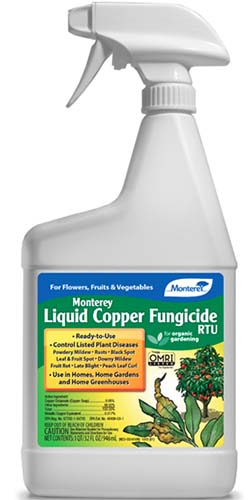 A close up of the packaging of Monterey Liquid Copper Fungicide spray bottle on a white background.