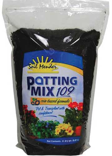 A close up vertical image of the packaging of Soil Mender 109 Potting Mix for houseplants.