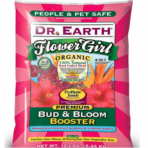A close up of the packaging of Dr Earth's Flower Girl organic fertilizer pictured on a white background.