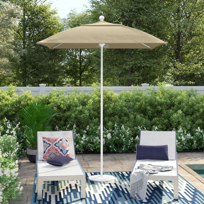 Hibo 72 Inch Square Market Sunbrella set up between two lounge chairs in a backyard setting.