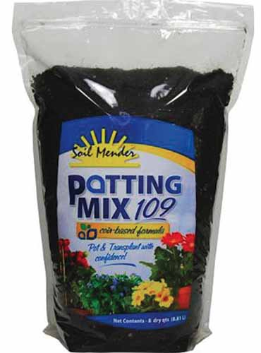 A close up square image of a package of Soil Mender Potting Mix 109 isolated on a white background.