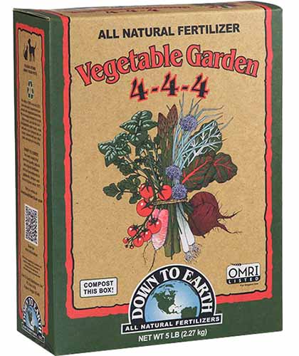 A close up square image of the packaging of Down To Earth's Vegetable Garden 4-4-4 All Purpose Fertilizer isolated on a white background.