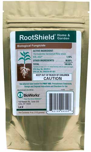 A close up vertical image of RootShield Home and Garden Biological Fungicide isolated on a white background.