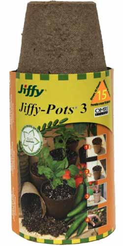 A close up vertical image of a packet of Jiffy Peat Pots isolated on a white background.