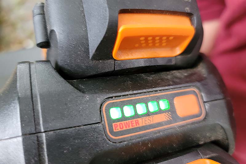 A close up horizontal image of the battery power indicator lights on a piece of equipment.