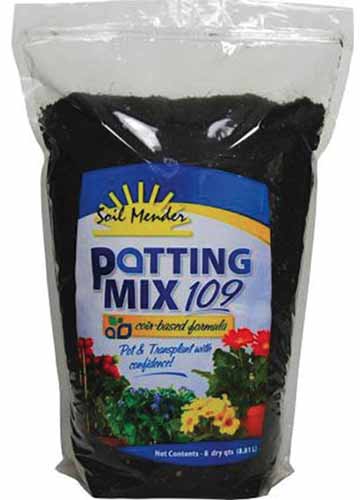 A close up vertical image of the packaging of Soil Mender Potting Mix 109 isolated on a white background.