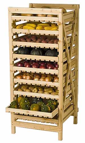 A close up vertical image of a wooden storage rack for vegetables and fruit.