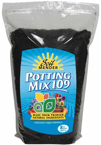 A close up vertical image of a bag of Soil Mender Potting Mix 109 isolated on a white background.