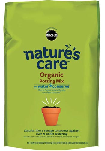 A close up vertical image of the packaging of Miracle-Gro Nature's Care Organic Potting Mix isolated on a white background.