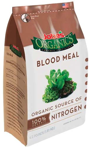 A close up vertical image of a bag of Jobe's Organics Blood Meal isolated on a white background.