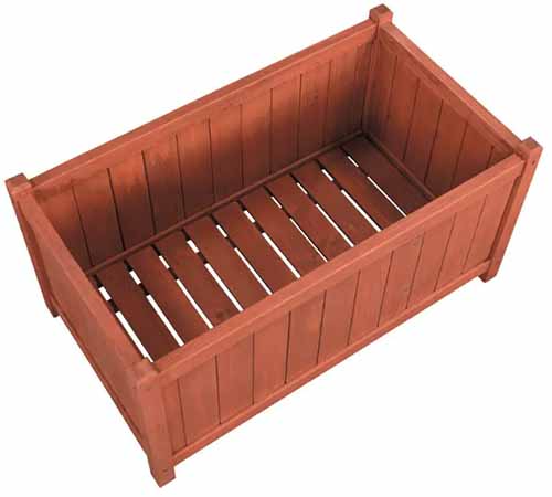 A close up of a cedar planter isolated on a white background.
