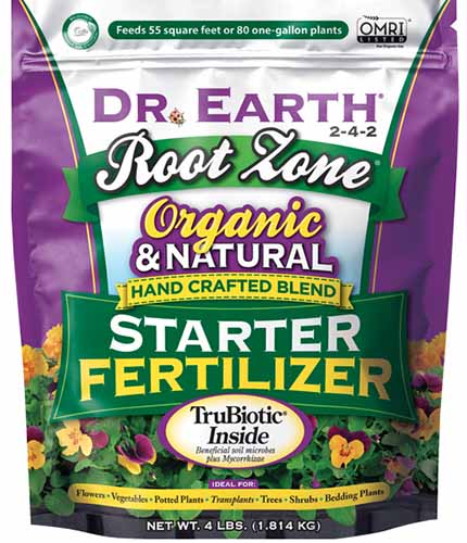 A close up of a bag of Dr Earth's Root Zone Organic and Natural Fertilizer isolated on a white background.