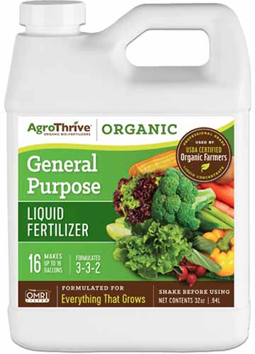 A close up of a bottle of AgroThrive Organic General Purpose Liquid Fertilizer isolated on a white background.