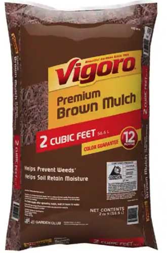 A close up of the packaging of Vigoro Premium Brown Mulch isolated on a white background.