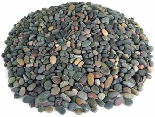 A close up of a pile of landscape pebbles isolated on a white background.