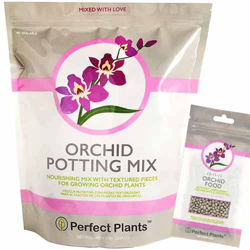 A close up of the packaging of Orchid Potting Mix isolated on a white backgorund.
