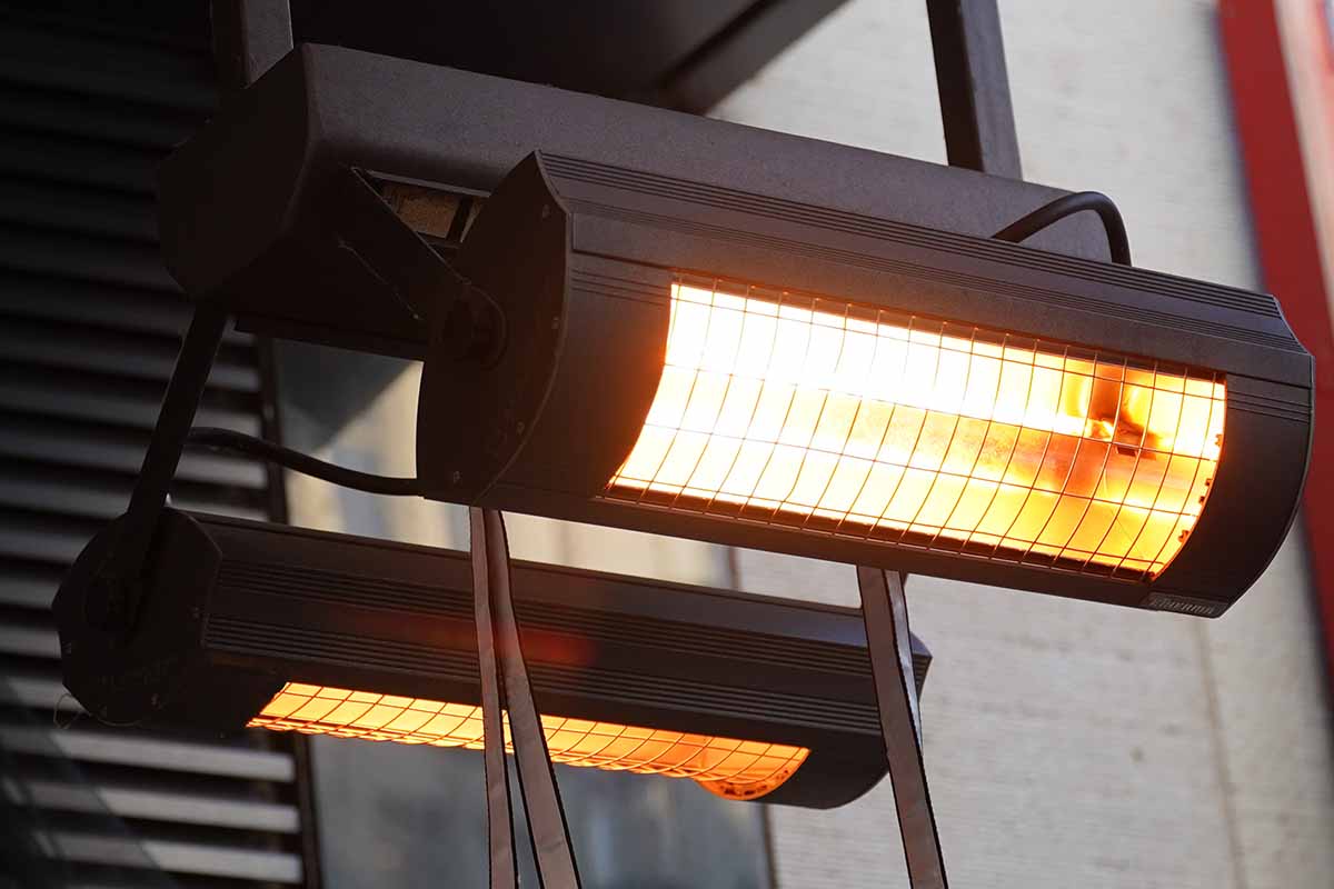 A close up horizontal image of a radiant heater affixed to a roof.