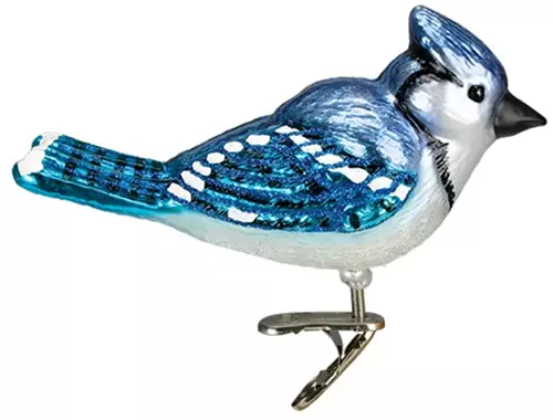 A close up of a bright blue jay glass clip-on ornament isolated on a white background.