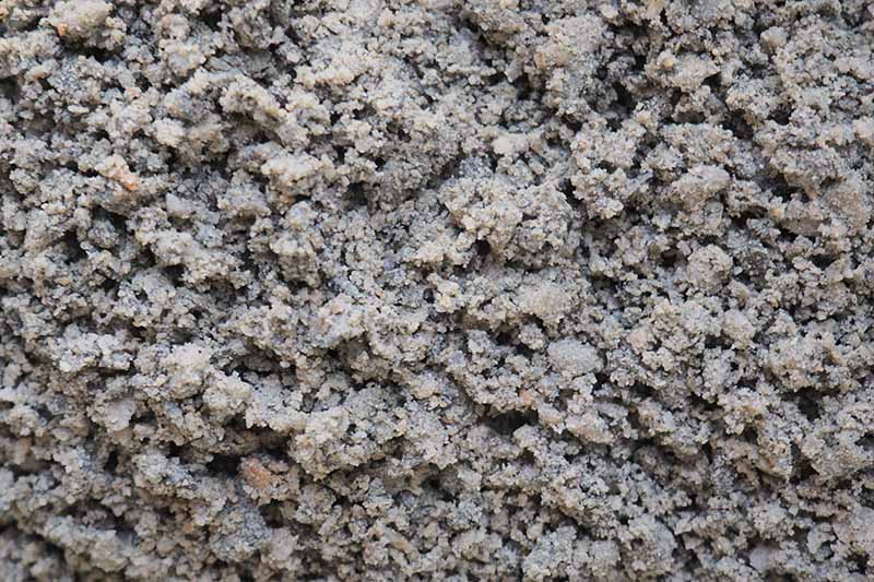 A close up horizontal image of granite grit.