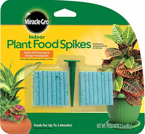 A close up of the packaging of Miracle-Gro Plant Food Spikes isolated on a white background.