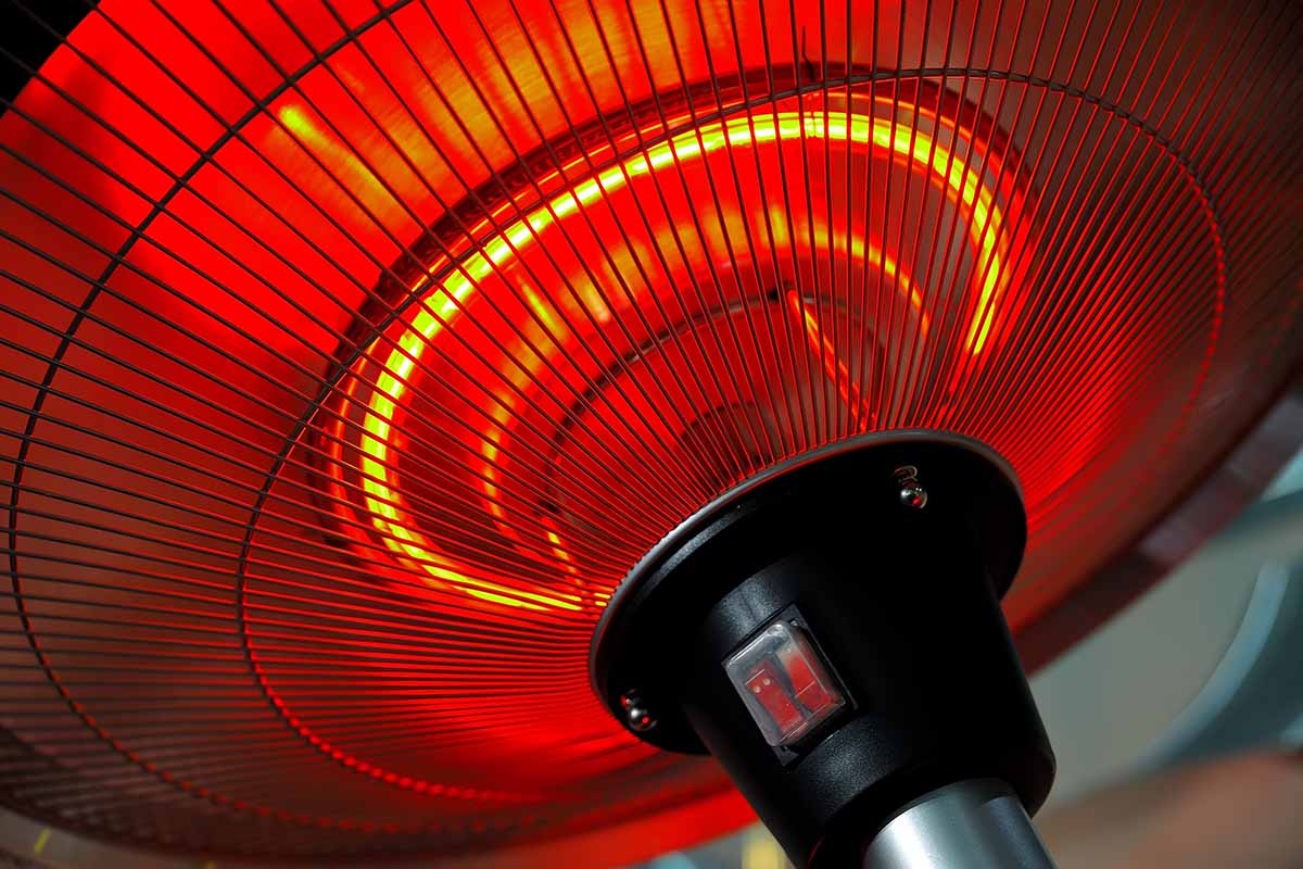 A close up horizontal image of an infrared bulb to heat an outdoor space.
