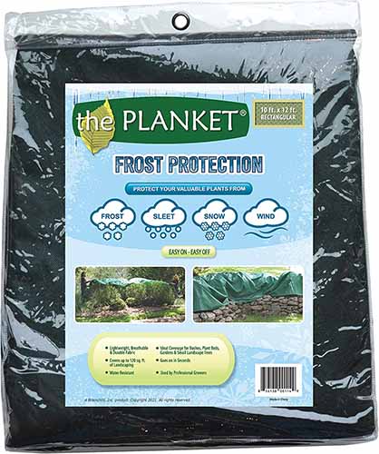A close up of the packaging of the Planket, a frost protection cover for plants, isolated on a white background.