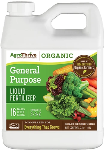 A close up of a bottle of AgroThrive General Purpose Fertilizer isolated on a white background.