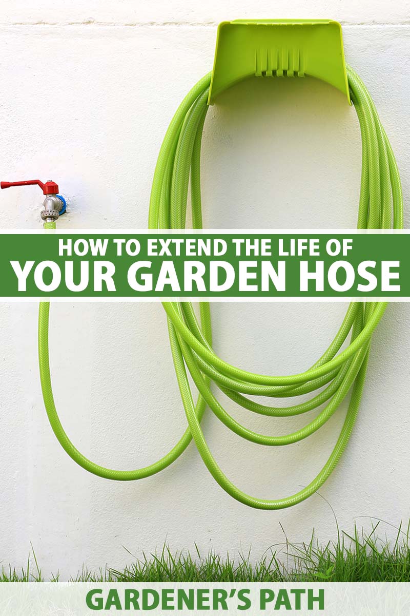 A vertical image of a green garden hose coiled up on a hose reel attached to the wall of a residence. To the center and bottom of the frame is green and white printed text.