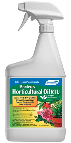 A close up of a bottle of Monterey Horticultural Oil isolated on a white background.