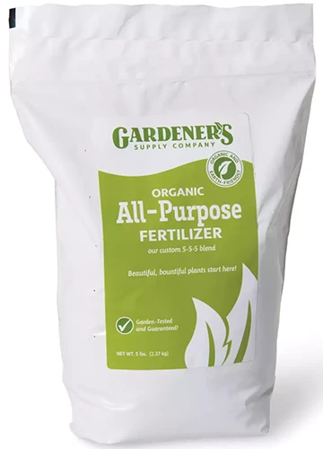 A close up of the packaging of Gardener's Supply Company Organic All-Purpose Fertilizer isolated on a white background.