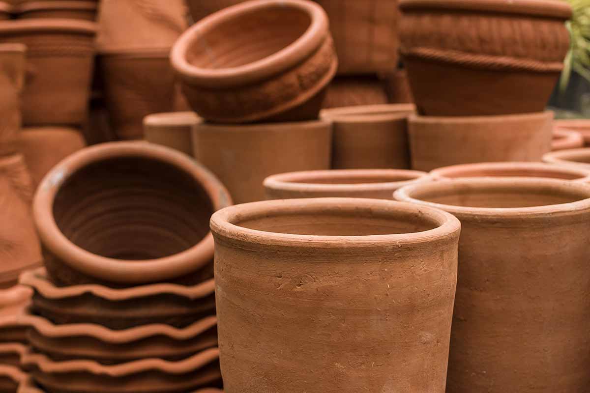 A horizontal image of a collection of terra cotta pots at a garden center.