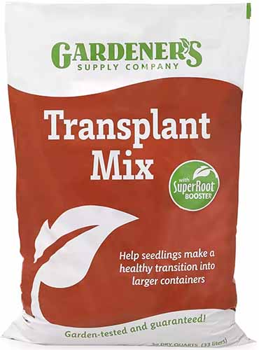 A close up of a bag of Gardener's Supply Company Transplant Mix isolated on a white background.