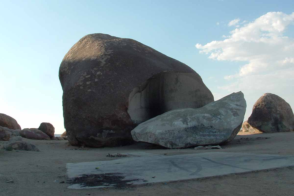 A horizontal image of Giant Rock, the world's largest freestanding boulder, sitting in the Mojave Desert near Landers, California.