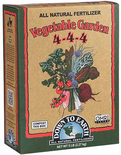 A vertical product photo of Down To Earth Vegetable Garden fertilizer in a cardboard box.
