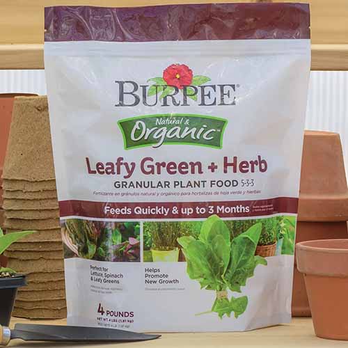 A square product shot of a bag of Burpee Leafy Green and Herb Food.