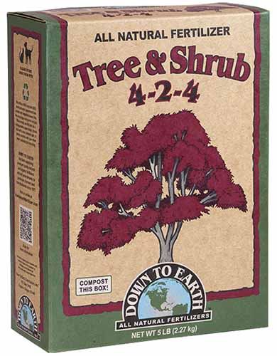 A vertical product photo of a box of Down to Earth Tree & Shrub 4-2-4 Fertilizer.