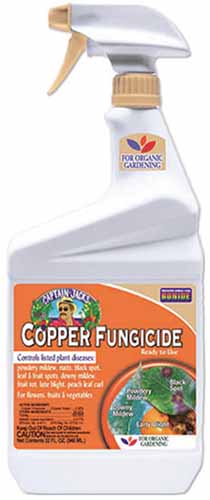 A close up of a spray bottle of Bonide Copper Fungicide isolated on a white background.