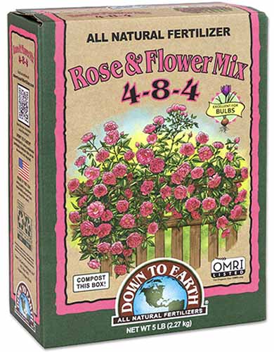 A close up of the packaging of Down to Earth Rose and Flower Mix isolated on a white background.