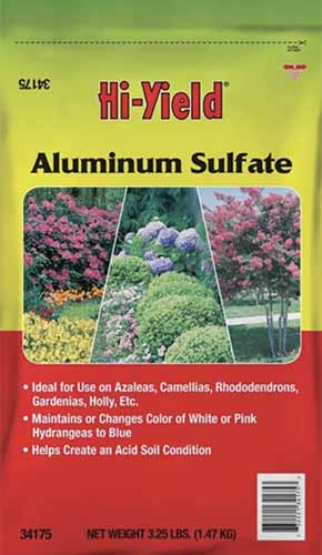 A close up vertical image of the packaging of Hi Yield Aluminum Sulfate pictured on a white background.