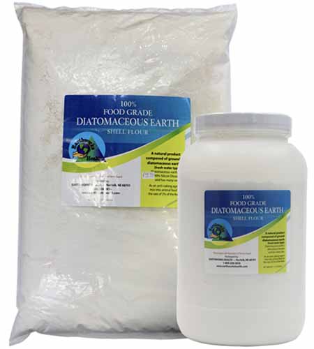 A close up of a bag and a jug of food grade diatomaceous earth isolated on a white background.