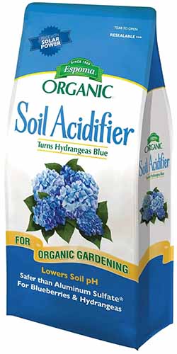 A close up of a bag of Espoma Soil Acidifier isolated on a white background.
